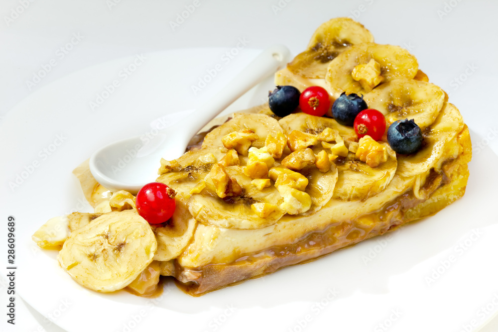 Banana dessert with nuts and berries