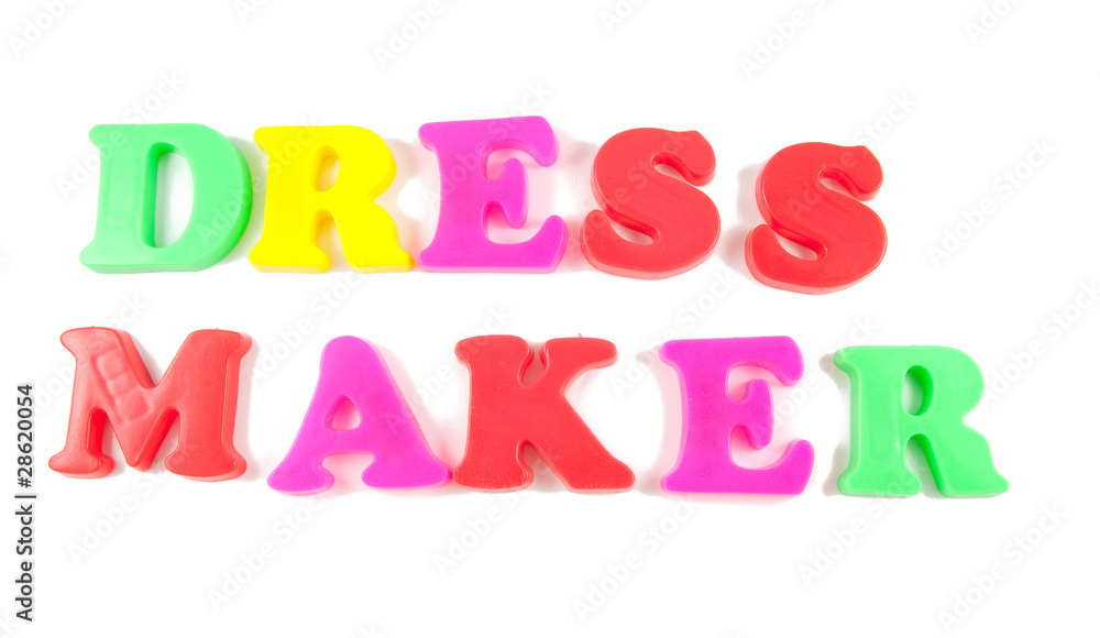 dress maker written in fridge magnets on white background dress maker written in fridge magnets on white background