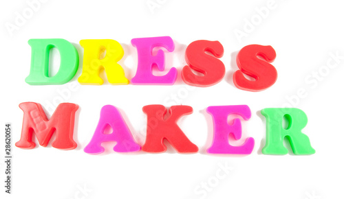 dress maker written in fridge magnets on white background