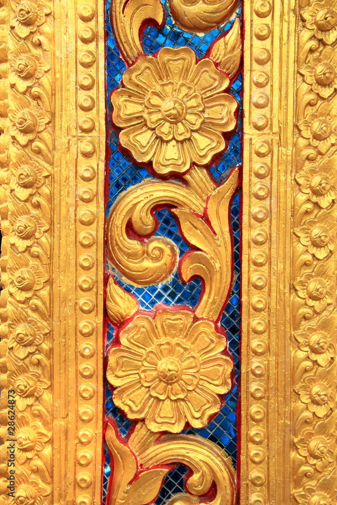 Golden Thai carve on temple door