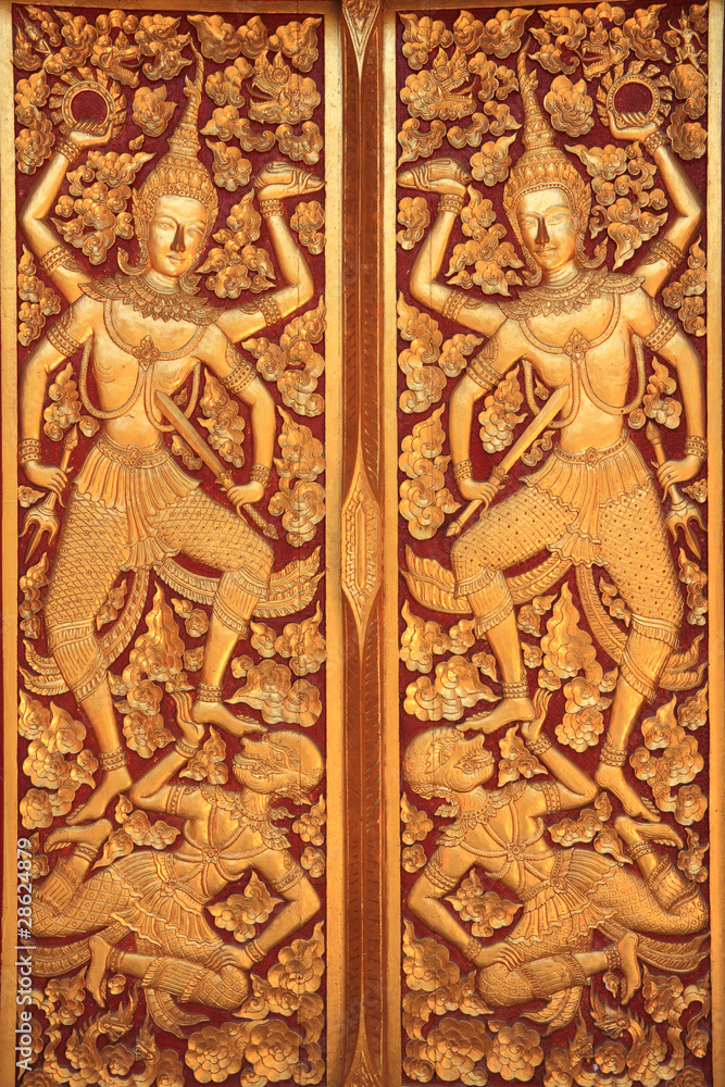 Close golden carve door of church