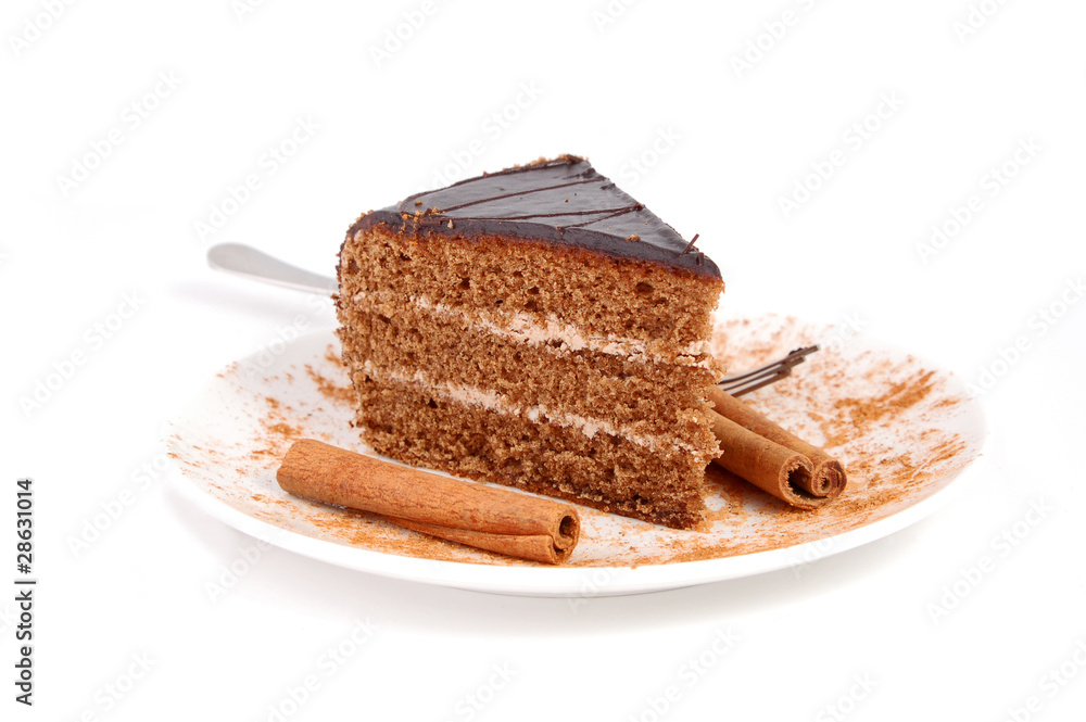 Slice of chocolate cream cake with cinnamon Slice of chocolate cream cake with cinnamon