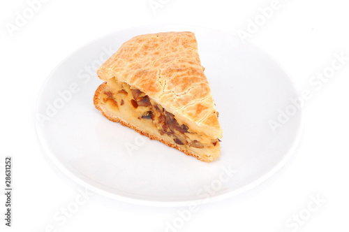 Mushroom pie on plate, isolated on white background