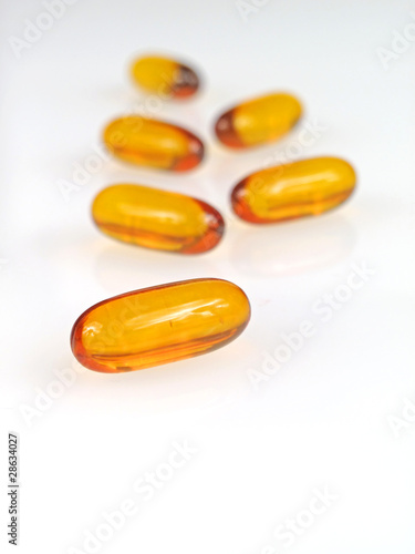 Yellow pills isolated on white