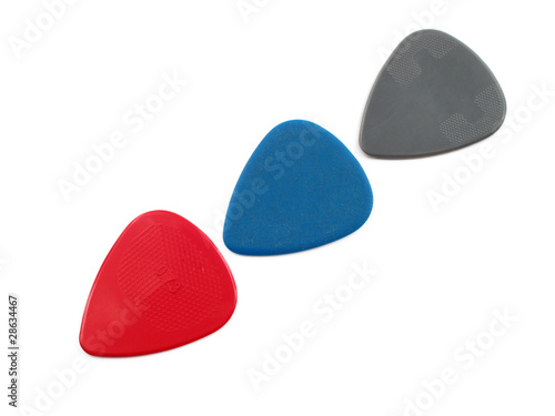 3 colour plectrums forming an arrow, isolated on white