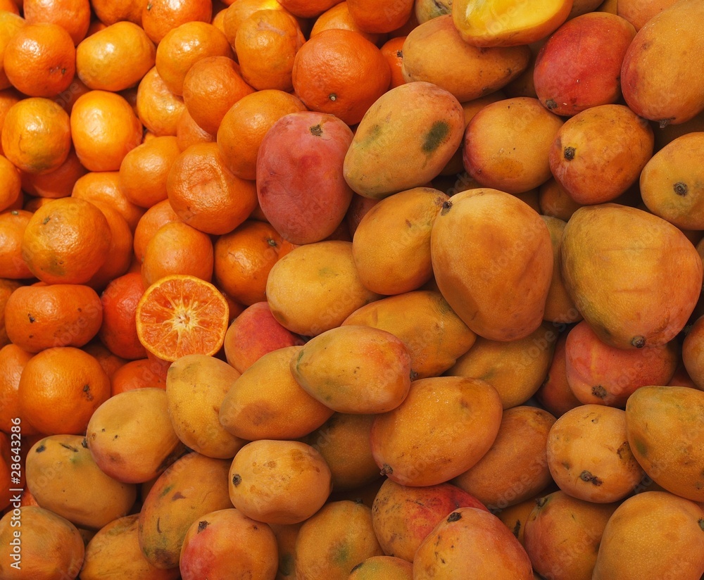 Oranges and mangos on the local marketplace, Peru Oranges and mangos on the local marketplace, Peru