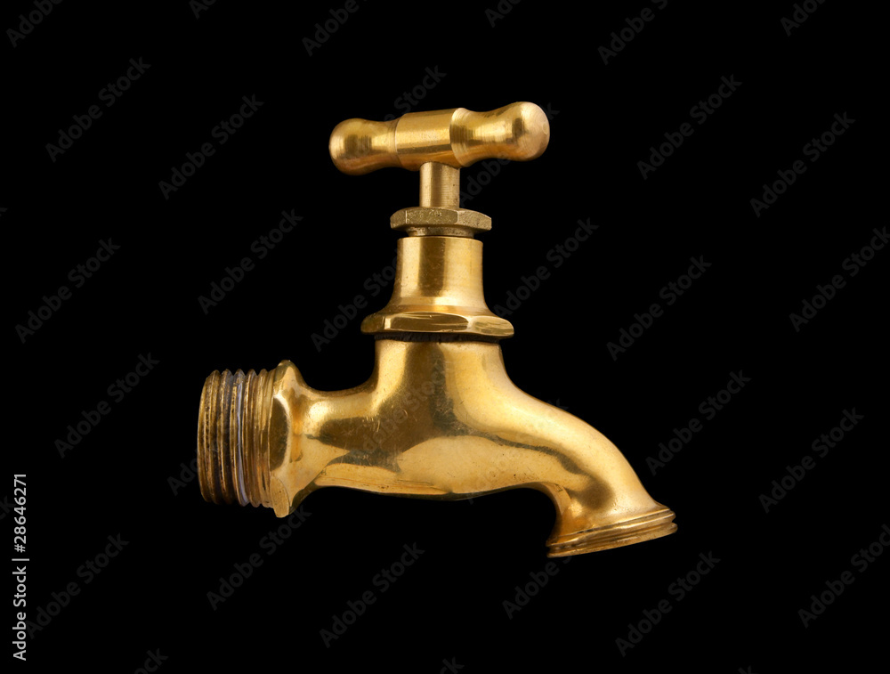 Metallic faucet isolated on black background Metallic faucet isolated on black background