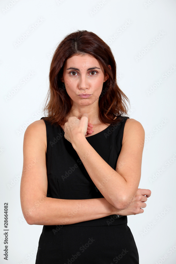 Woman in black dress with thoughtful look Woman in black dress with thoughtful look