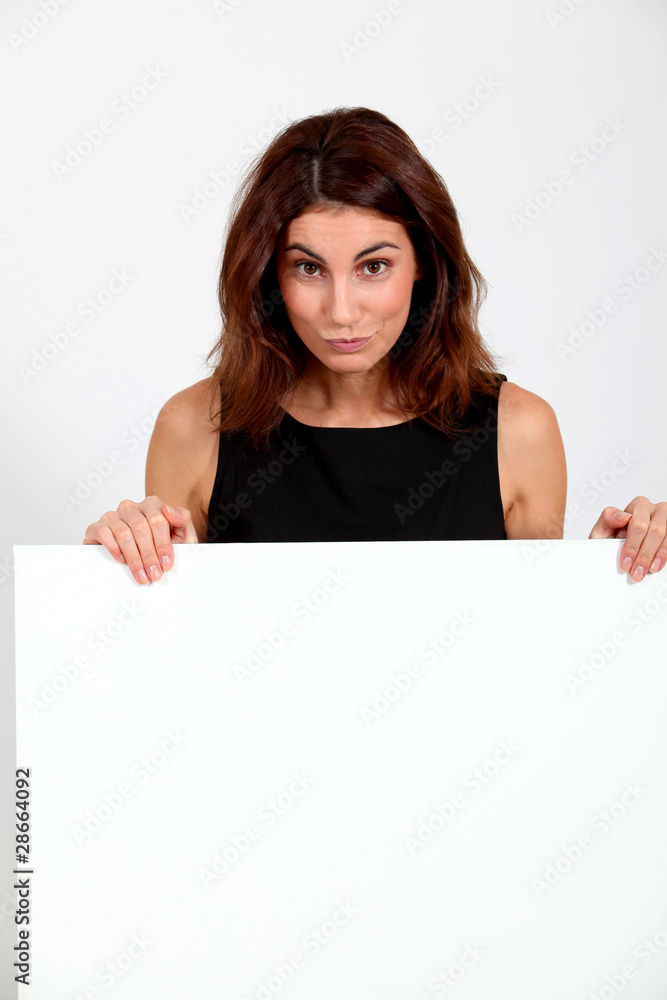 Portrait of businesswoman holding whiteboard Portrait of businesswoman holding whiteboard