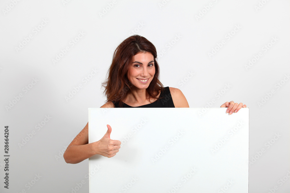 Portrait of businesswoman holding whiteboard Portrait of businesswoman holding whiteboard