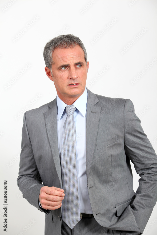 Smiling businessman standing on white background Smiling businessman standing on white background