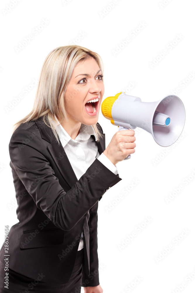 Frustrated businesswoman yelling through a megaphone Frustrated businesswoman yelling through a megaphone