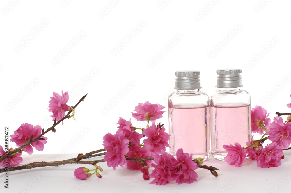 bottle of body lotion with red flower bottle of body lotion with red flower