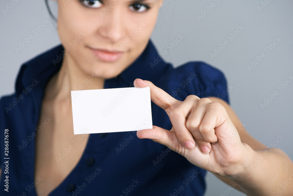 Young businesswoman handing a blank Young businesswoman handing a blank