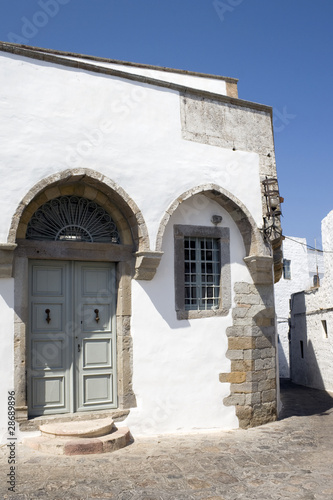 Patmos - Ancient house with gothic arches © tella0303