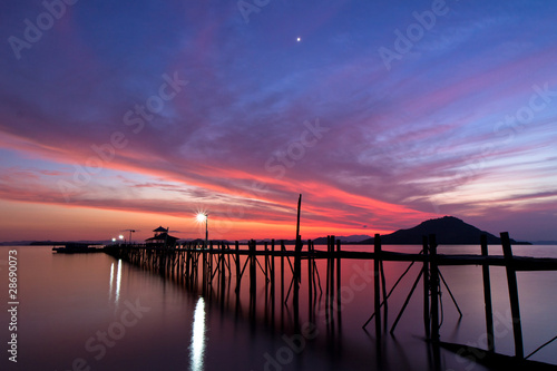 sunset at Kanawa Island, Indonesia photo