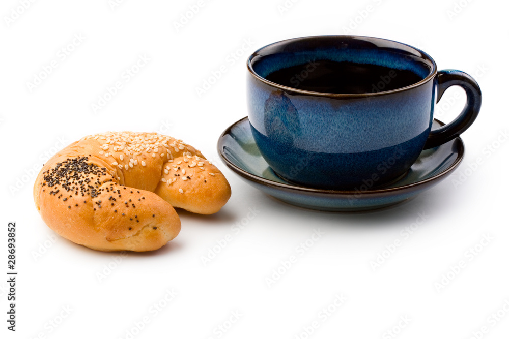 Mug and bun isolated on white Mug and bun isolated on white