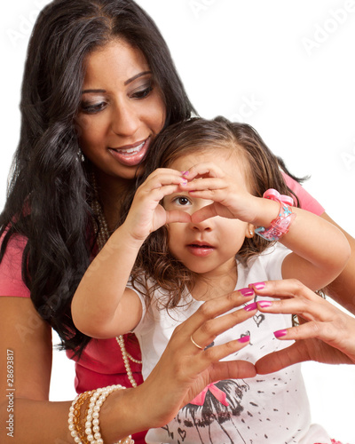 Mother and Daughter using hands to make hearts