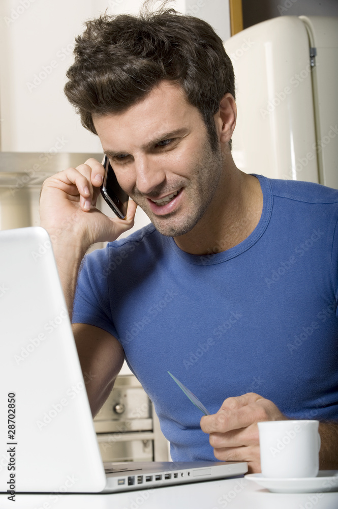 man in the kitchen with laptop man in the kitchen with laptop