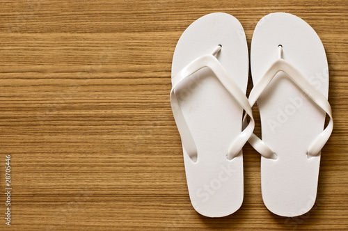 Slika na platnu flip-flop on wood floor