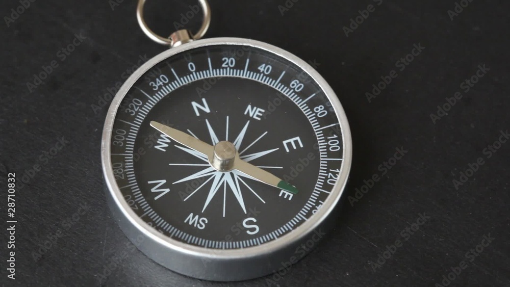 top view of rotating compass with flickering pointer top view of rotating compass with flickering pointer