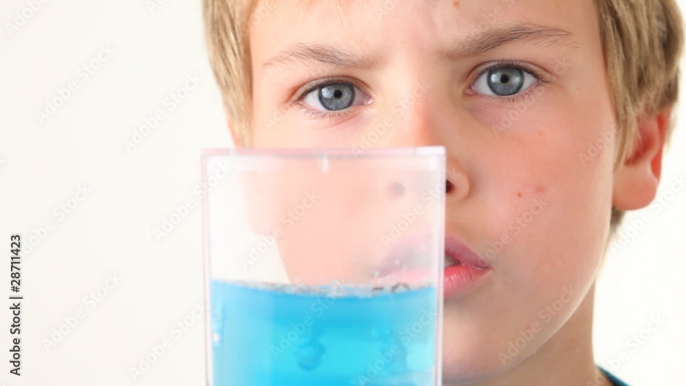 happy boy looking at farm of ants