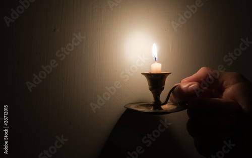 Hand holding vintage lamp