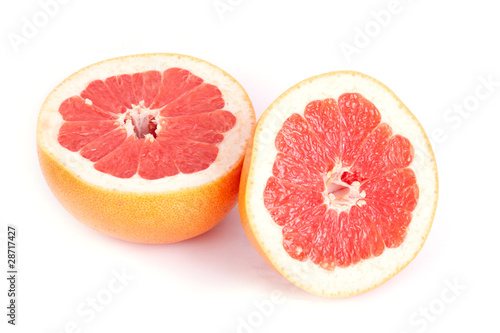 Ripe sliced grapefruit isolated on white background.