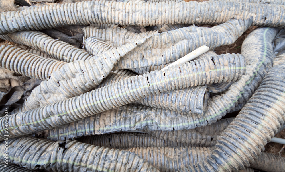 Big Pile of Dirty Black Plastic Drainage Tubes Big Pile of Dirty Black Plastic Drainage Tubes