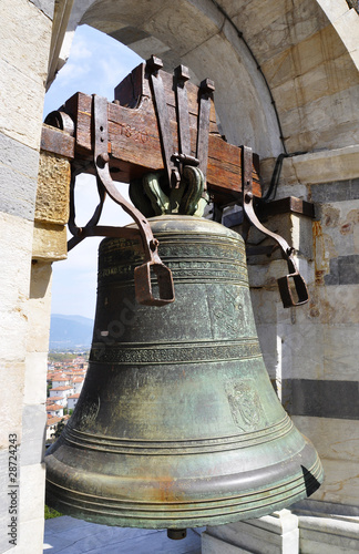 Bronze bell on top of the Leaning Tower of Pisa, Italy photo