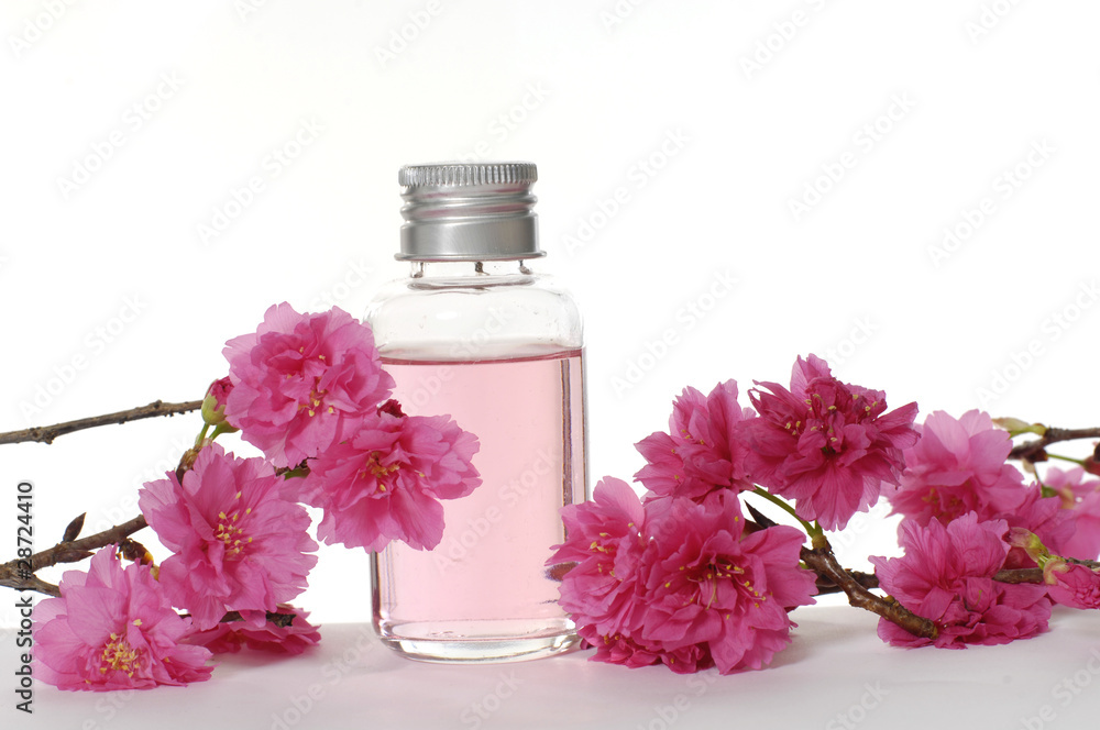 An orchid with a bottle of massage oil, An orchid with a bottle of massage oil,