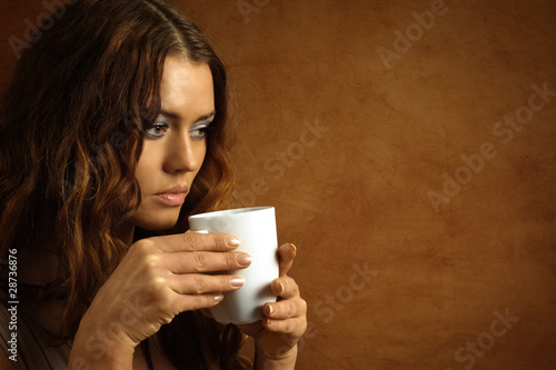 Woman with cup of hot drink