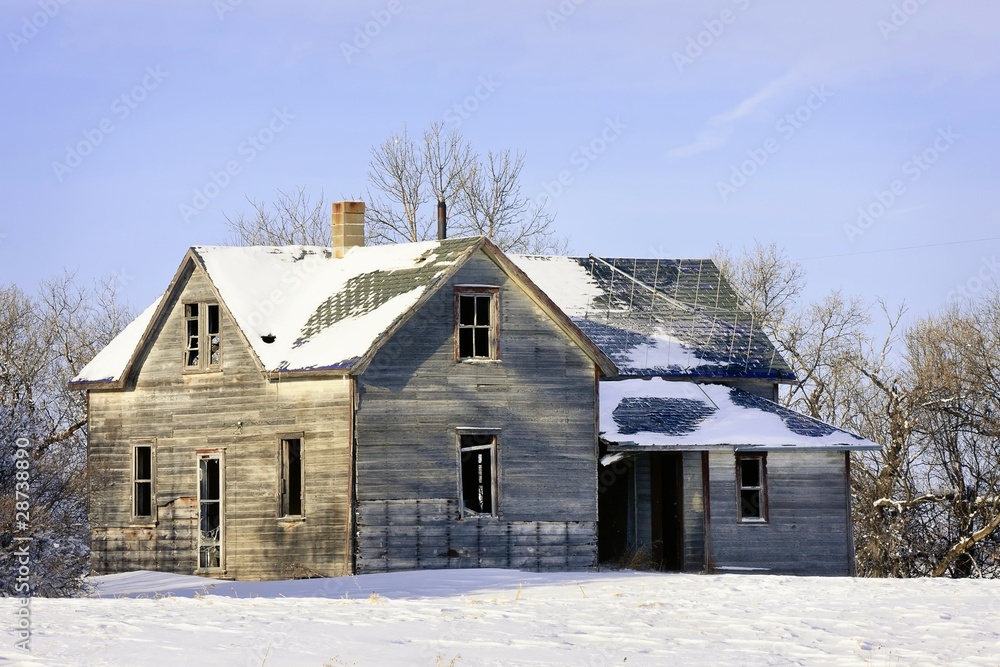 Old abandoned lonely farm house in Winter