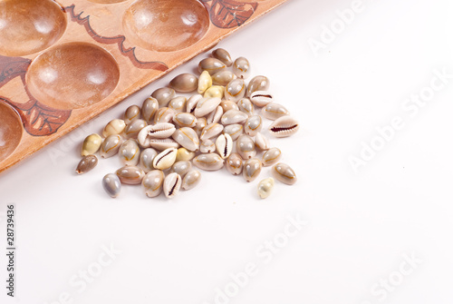 Mancala Game Shell Pieces with Board Background
