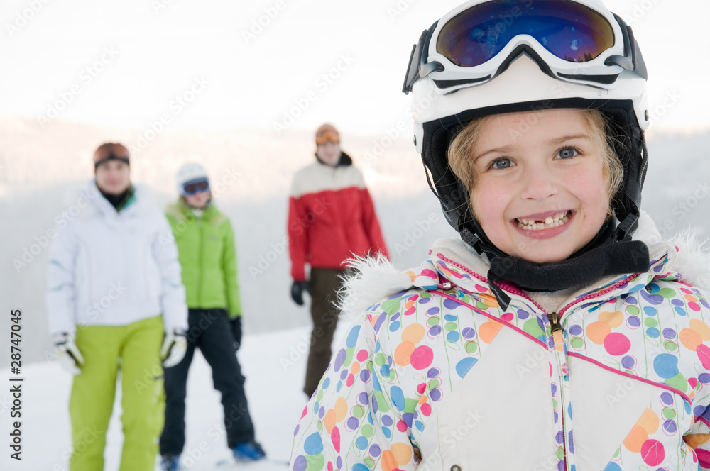 Little girl with family on ski Little girl with family on ski