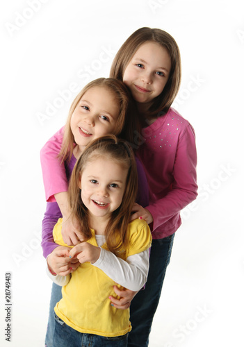 Three young sisters having fun