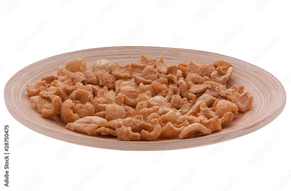 Schweineschwarte auf Holzteller Schweineschwarte auf Holzteller