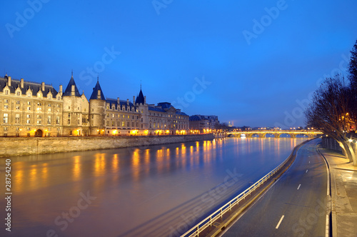 reflections of lights and buildings on the river seine