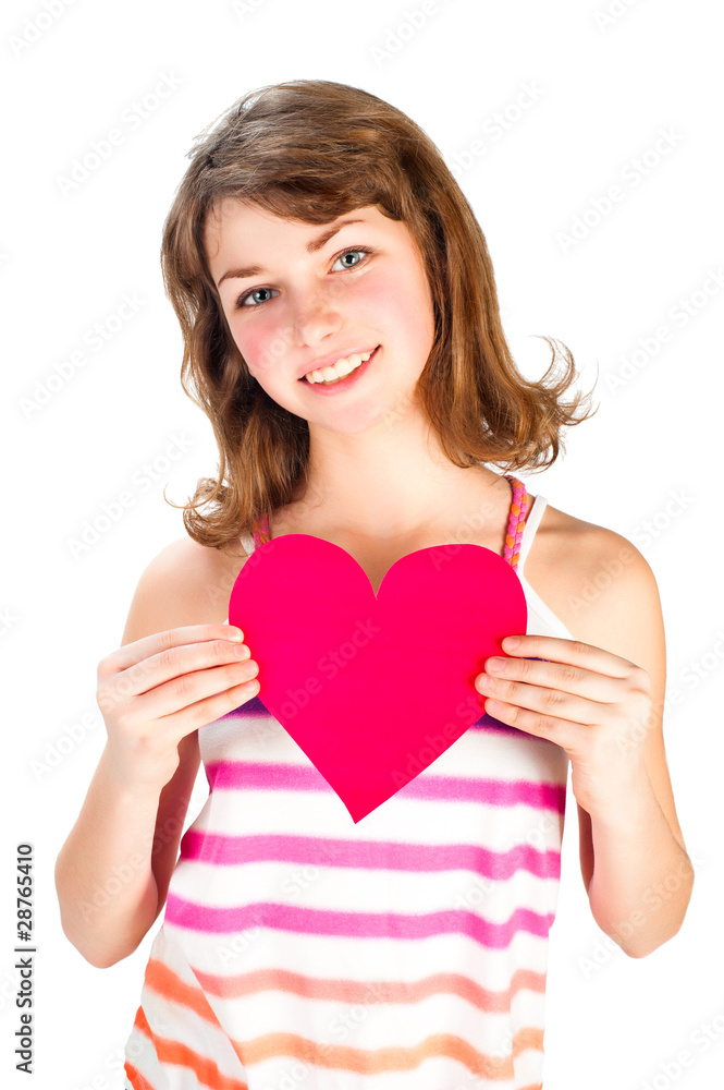 Cute smiling girl in bright dress holding valentine heart Cute smiling girl in bright dress holding valentine heart