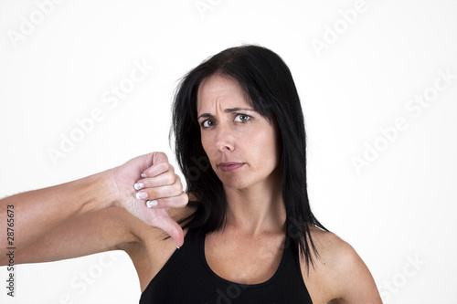 Fotografie Woman showing thumbs down, negative