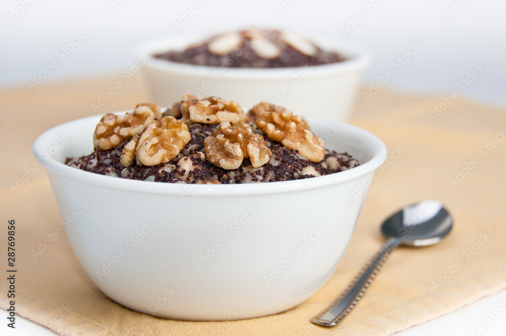 Two bowls with traditional Christmas kutia dessert on yellow nap Two bowls with traditional Christmas kutia dessert on yellow nap