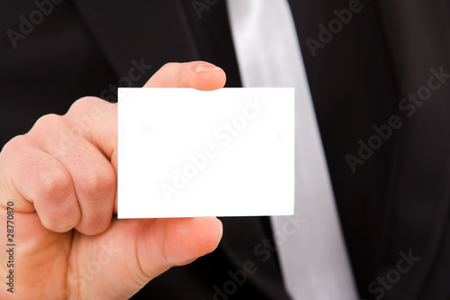 hand of businessman offering businesscard