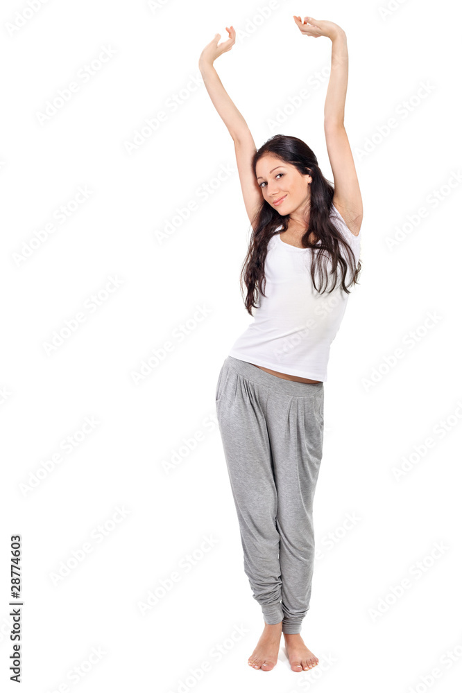 Young beautiful brunette lady stretching after awaking Young beautiful brunette lady stretching after awaking