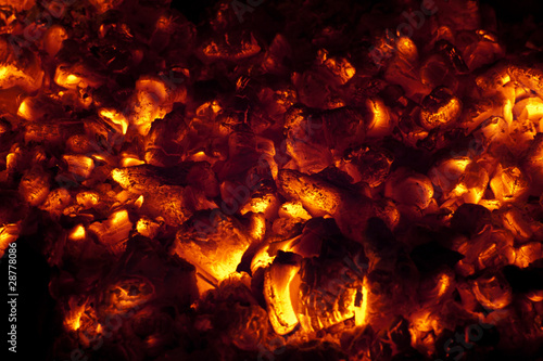 Coals burning flameless in fireplace