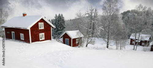 red cottage, snow and ice in sweden © christian42