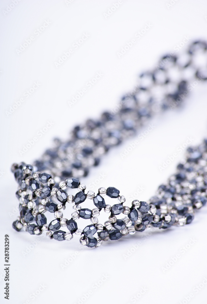 Silver necklace with gems isolated on white Silver necklace with gems isolated on white