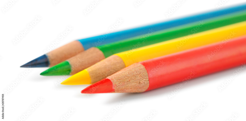 Isolated colored pencils. Yellow, blue, green and red pencils in a row isolated on white background Isolated colored pencils. Yellow, blue, green and red pencils in a row isolated on white background