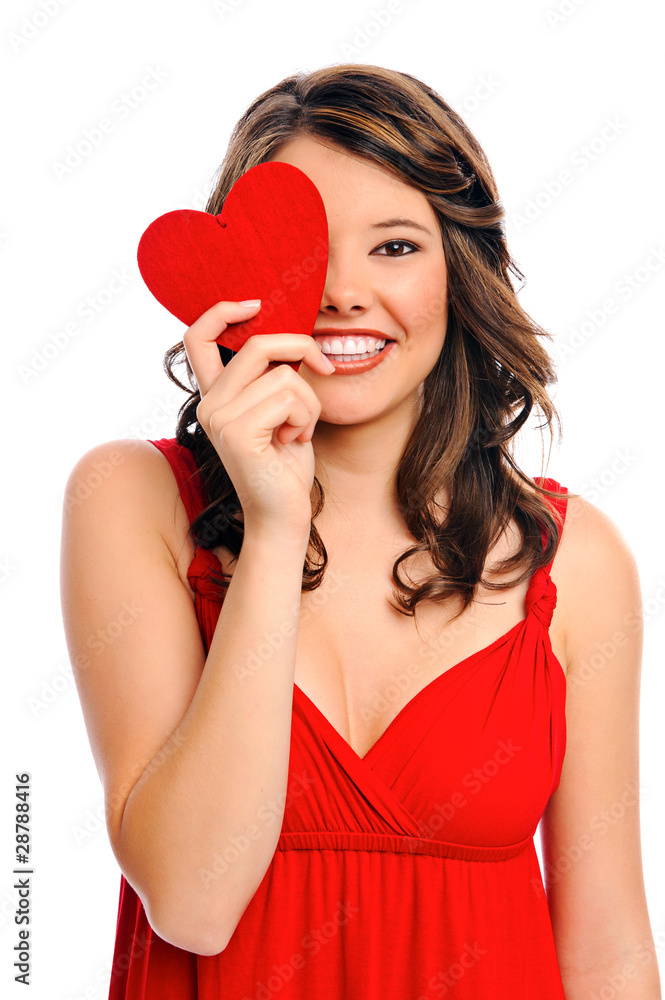 Young woman hides behind heart Young woman hides behind heart