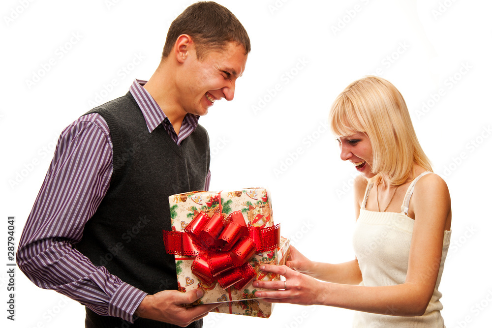 Guy gives the girl a gift isolated on white Guy gives the girl a gift isolated on white