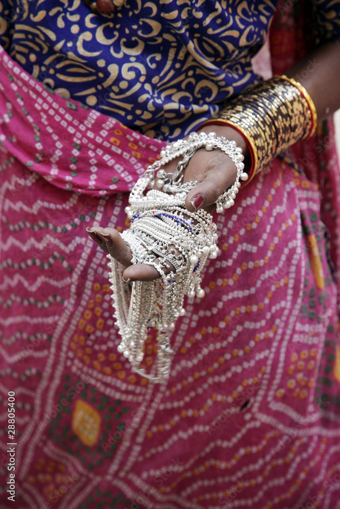 indian woman showing traditional jewelry.